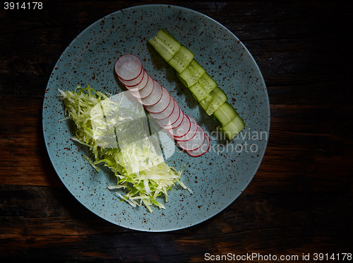 Image of Fresh spring light vegetarian salad with cucumber and radish