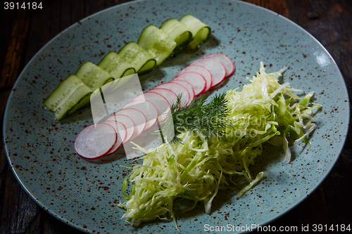 Image of Fresh spring light vegetarian salad with cucumber and radish