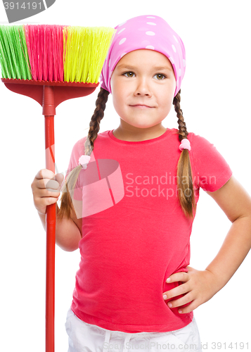 Image of Young girl is dressed as a cleaning maid