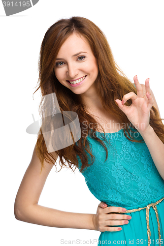 Image of Woman is showing OK sign