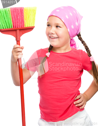 Image of Young girl is dressed as a cleaning maid