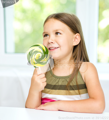 Image of Little girl with lollipop