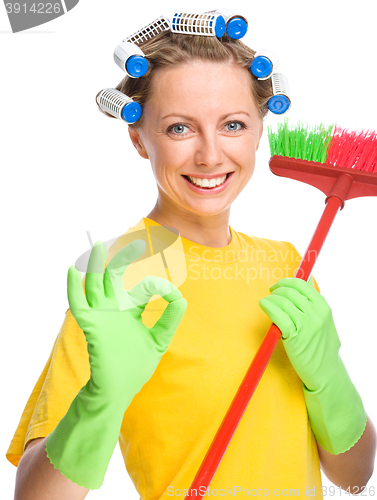 Image of Young woman as a cleaning maid