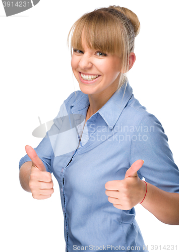 Image of Woman is showing thumb up gesture