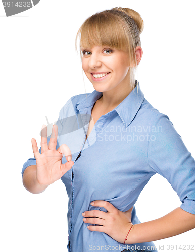 Image of Woman is showing OK sign