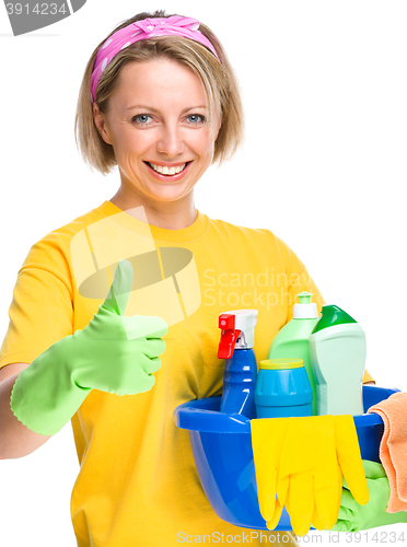 Image of Young woman as a cleaning maid