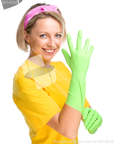 Image of Young woman as a cleaning maid