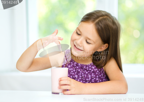 Image of Little girl with a glass of milk