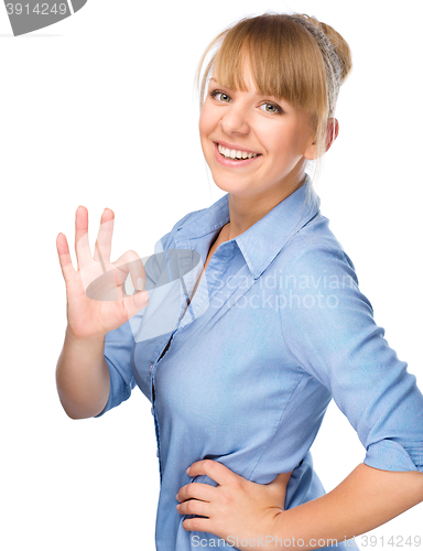 Image of Woman is showing OK sign