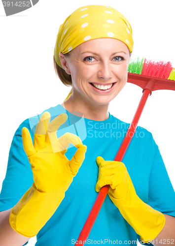 Image of Young woman as a cleaning maid