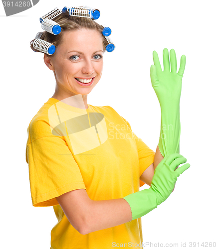 Image of Young woman as a cleaning maid