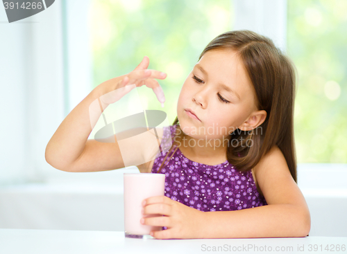 Image of Little girl with a glass of milk