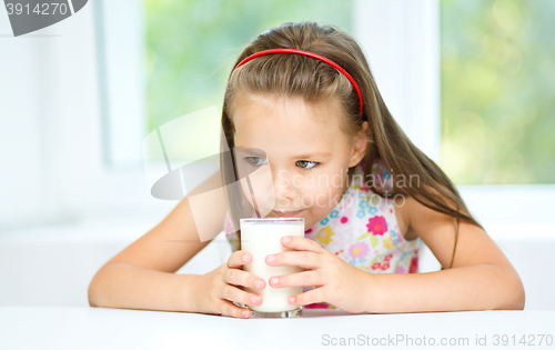 Image of Little girl with a glass of milk