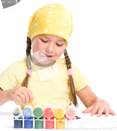 Image of Cute child play with paints
