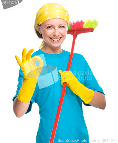 Image of Young woman as a cleaning maid