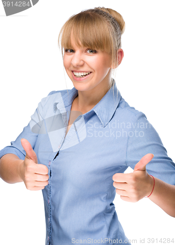 Image of Woman is showing thumb up gesture