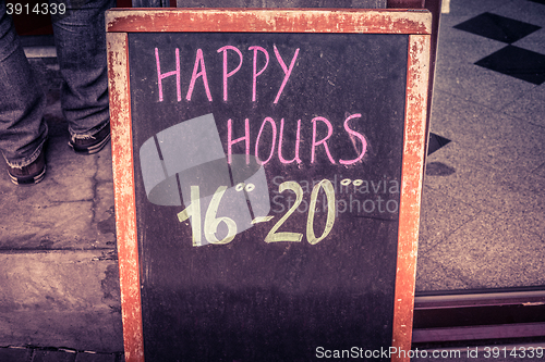 Image of Happy hour board with text