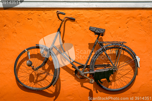 Image of Vintage bike hanging on a wall