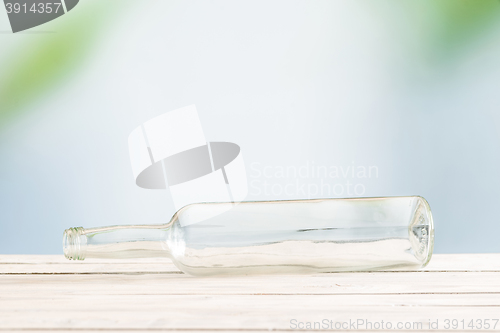 Image of Glass bottle on a wooden table