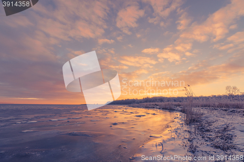 Image of Sunrise over a frozen lake