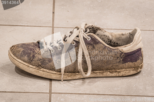 Image of Dirty shoe with white laces