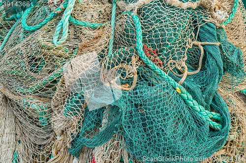 Image of Fishing net by a harbor