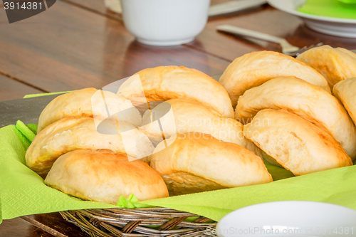 Image of Buns in a basket on a table