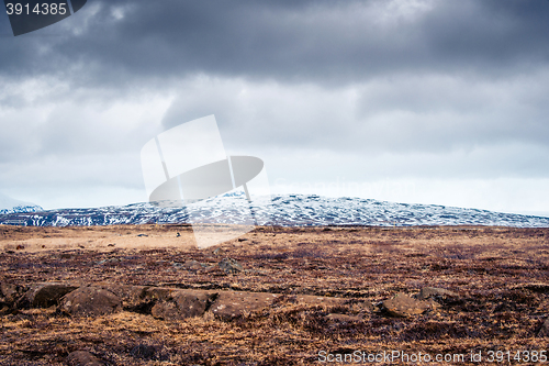 Image of Cloudy weather over a rough field