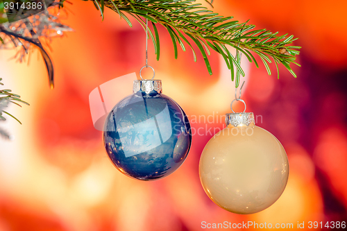 Image of Shiny xmas baubles on a tree