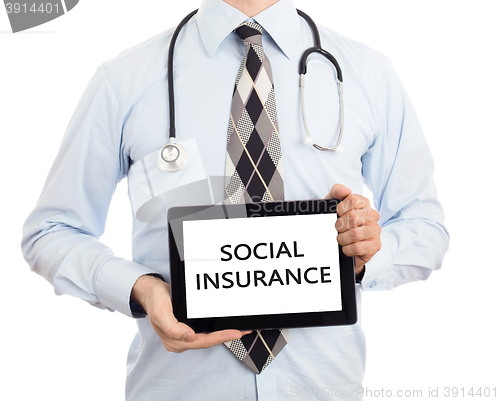 Image of Doctor holding tablet - Social insurance