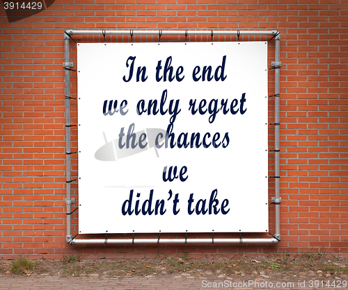 Image of Large banner with inspirational quote on a brick wall