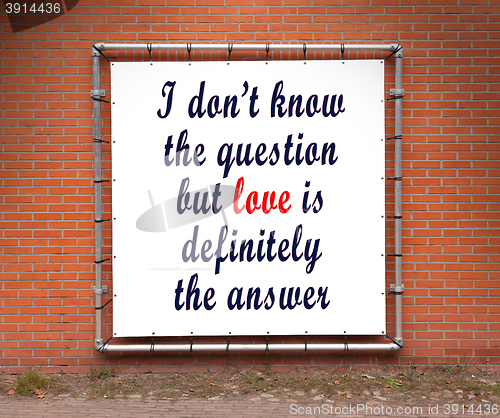 Image of Large banner with inspirational quote on a brick wall