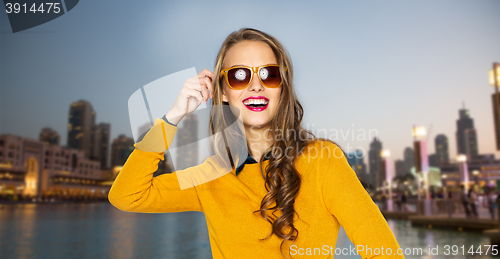 Image of happy young woman or teen girl in casual clothes