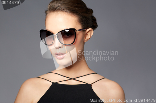 Image of beautiful young woman in elegant black sunglasses