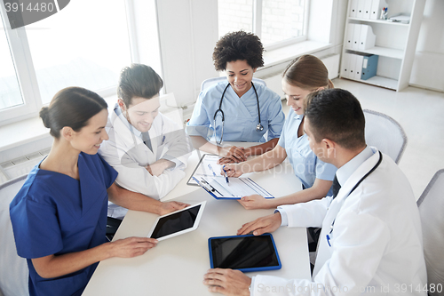 Image of group of happy doctors meeting at hospital office