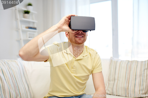 Image of young man in virtual reality headset or 3d glasses