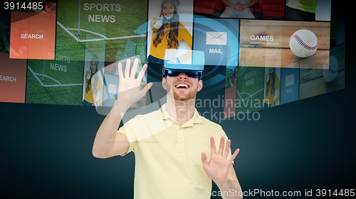 Image of happy man in virtual reality headset or 3d glasses