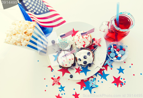 Image of cupcakes with american flags on independence day