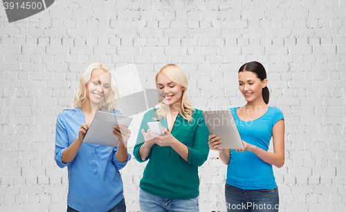 Image of happy women with smartphone and tablet pc computer