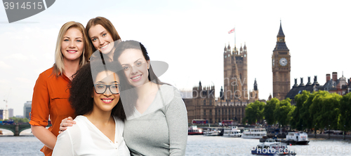 Image of group of happy different women over london city