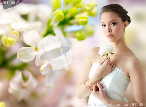 Image of beautiful asian woman with flower and jewelry