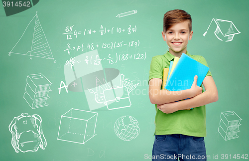 Image of happy student boy with folders and notebooks