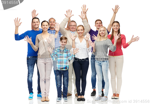 Image of group of smiling people waving hands