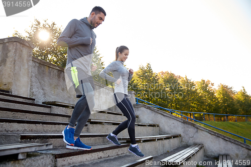 Image of couple running downstairs on stadium