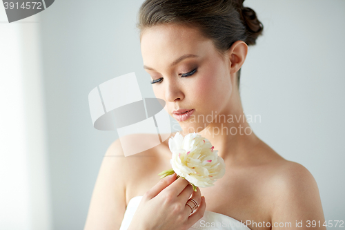 Image of beautiful asian woman with flower and jewelry