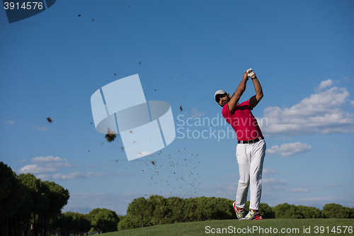 Image of golf player hitting long shot