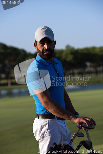 Image of golfer  portrait at golf course