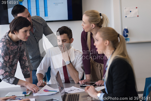 Image of young business people group on meeting at modern office