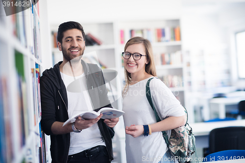 Image of students couple  in school  library