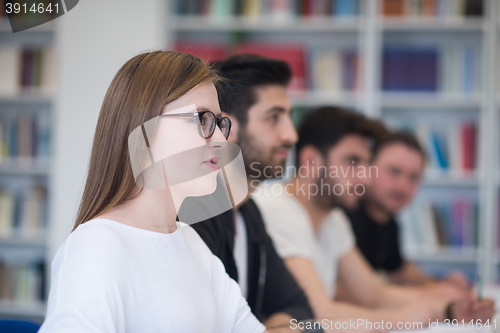 Image of group of students study together in classroom